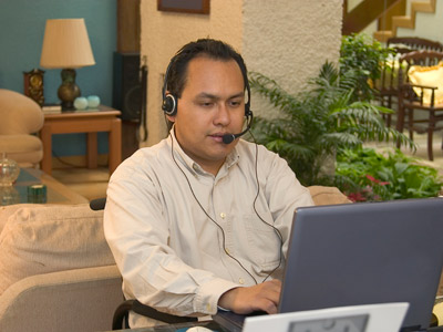 Man using a computer with a headset