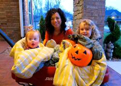 Woman and two children celebrating Halloween